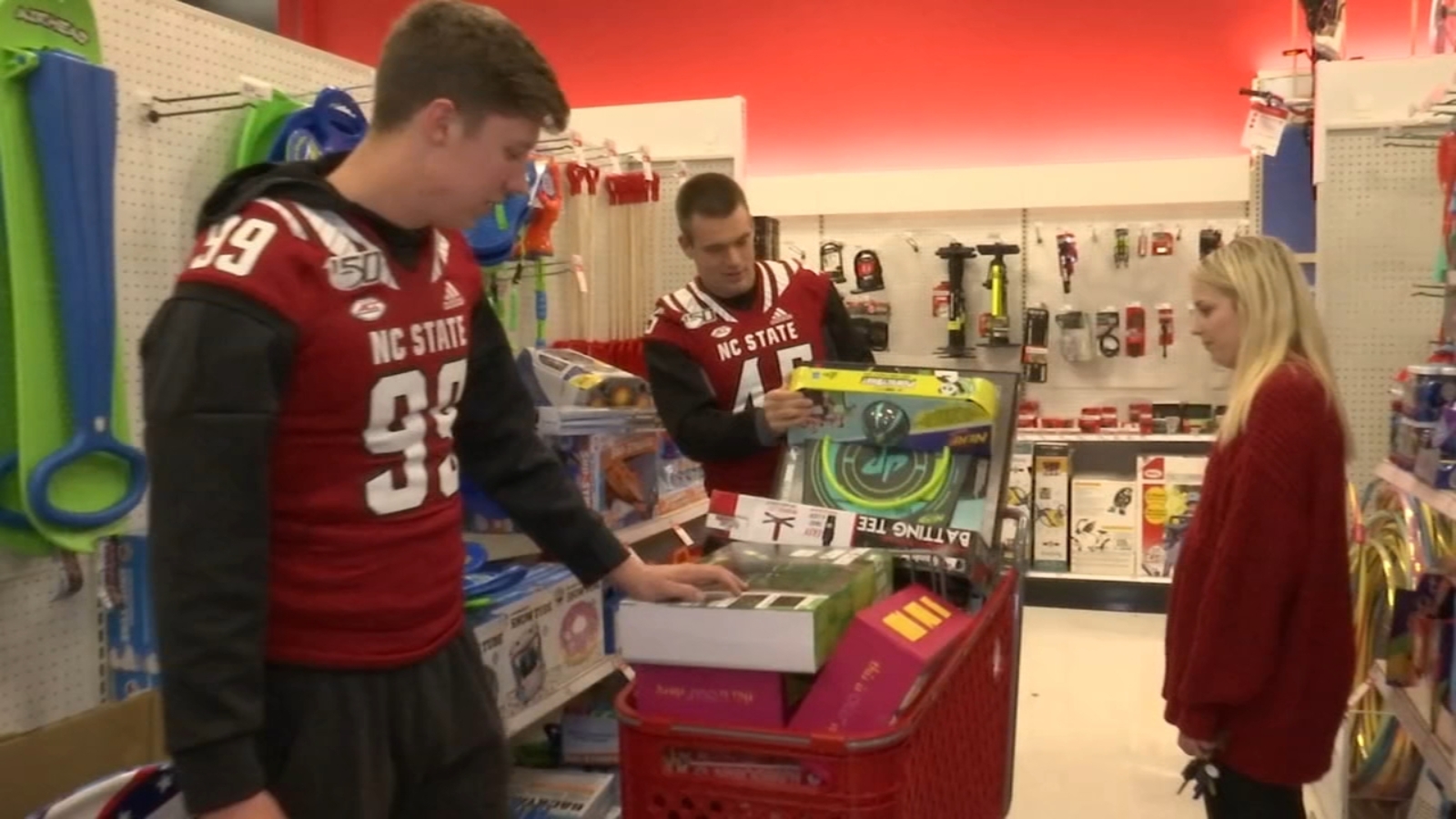 NC State football players go shopping for annual Toys for Tots holiday