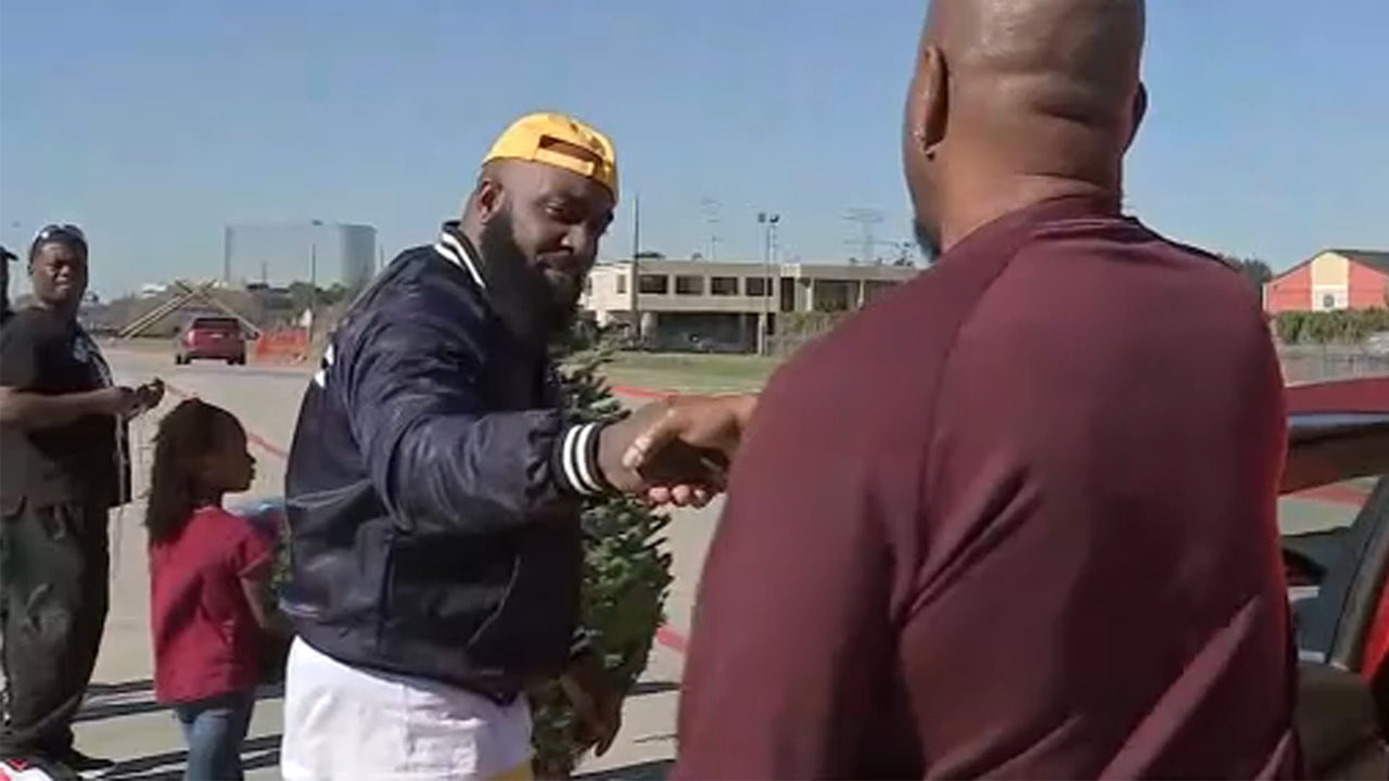 Trae Tha Truth gives Christmas trees to families in need
