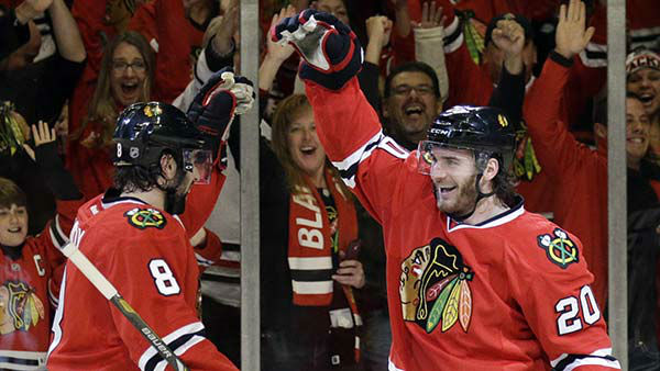 Chicago Blackhawks' Brandon Saad (20), right, celebrates with Nick Leddy (8) after scoring his goal.