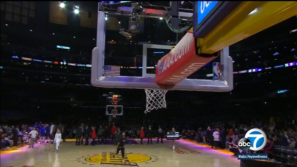 VIDEO: Laker fan makes basket from half-court, wins $100,000