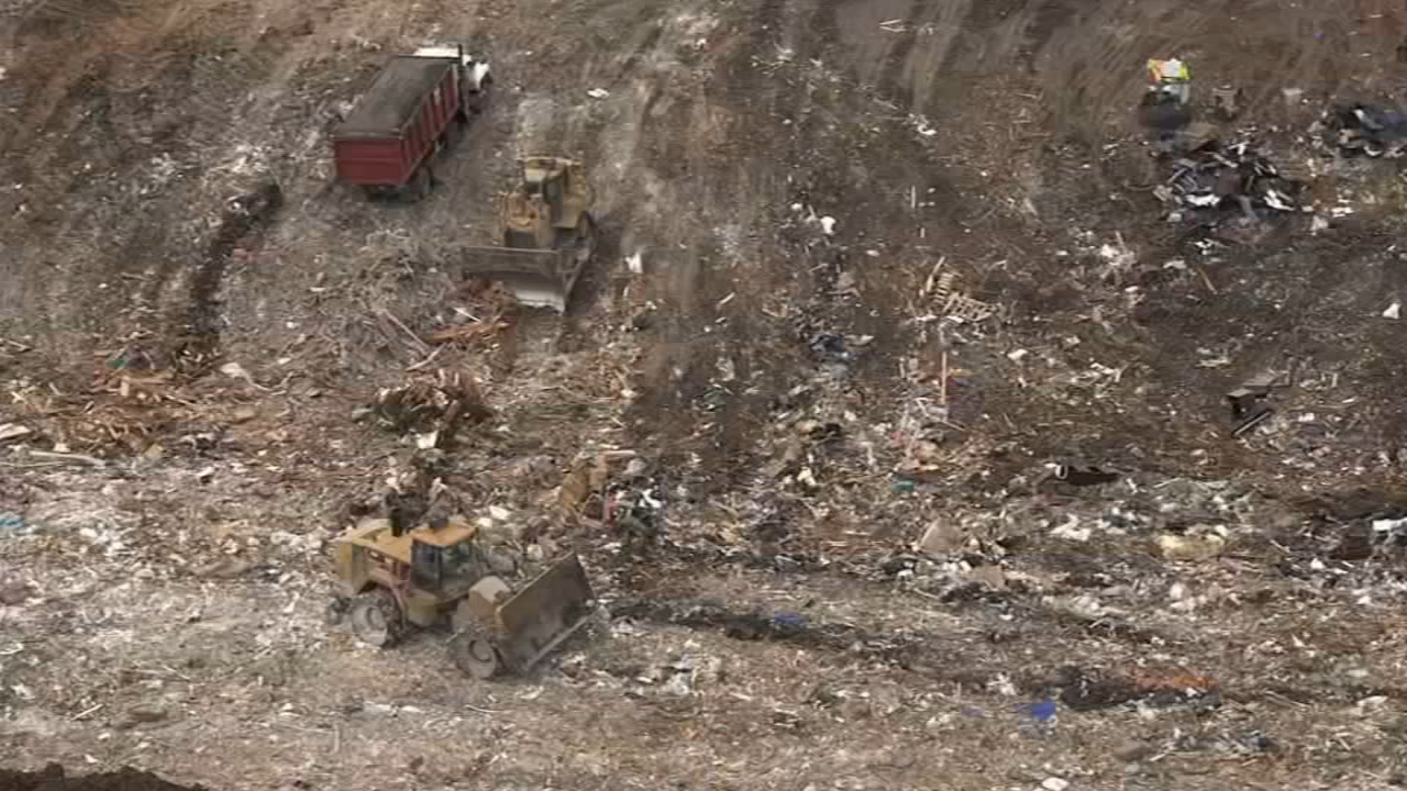 Investigators are trying to identify a victim who was dumped in a landfill by a garbage truck