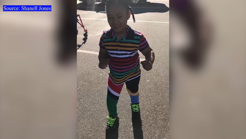 Mom teaches daughter to walk