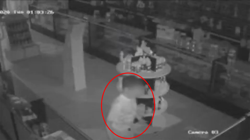 Surveillance video shows barefoot child break into smoke shop