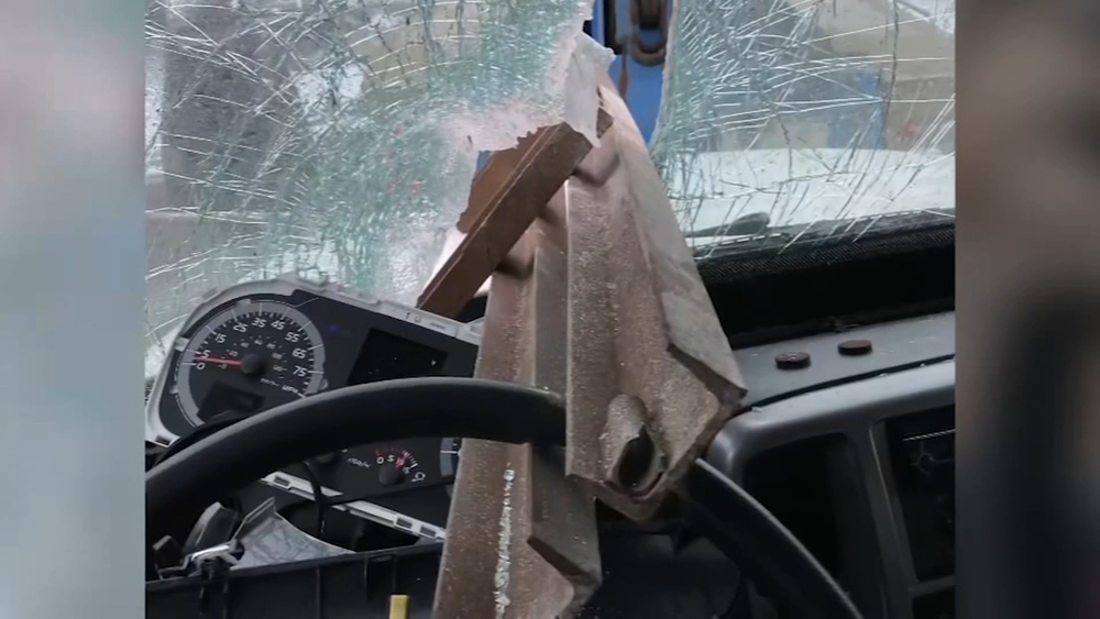 Steel beam narrowly misses man driving on MI freeway