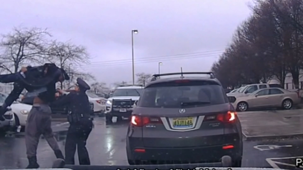 Video: College football player throws police officer to the ground