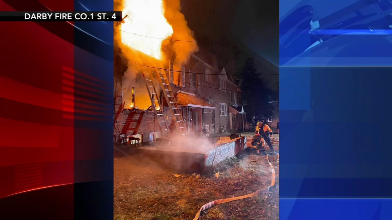 Witnesses said two people jumped from windows to escape the flames