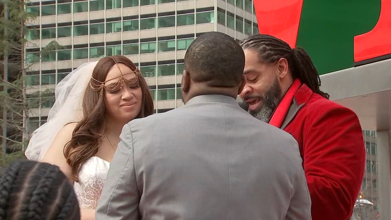 Couples tie the knot at Philadelphia's iconic LOVE Park for Valentine's Day