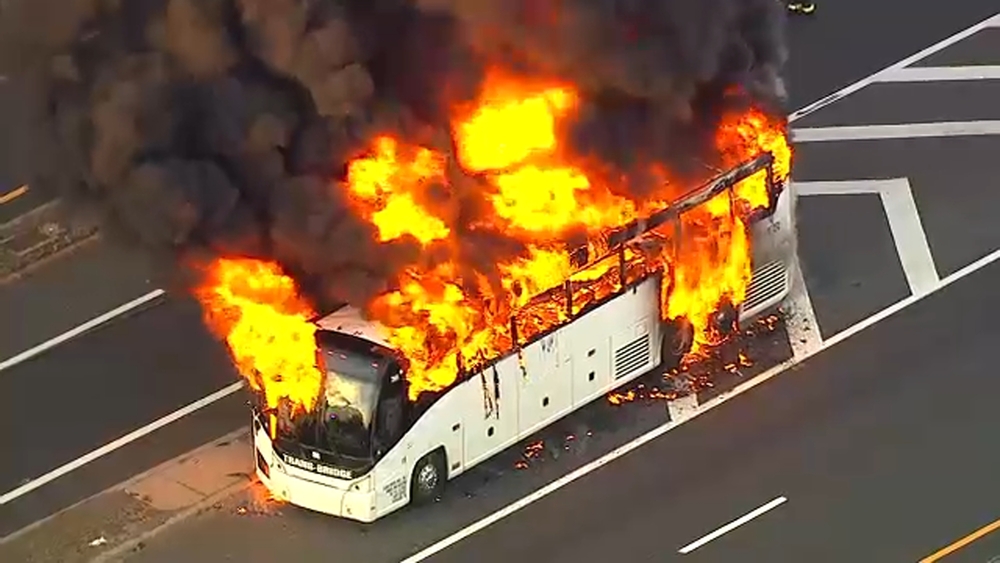 Tour bus bursts into flames in NJ