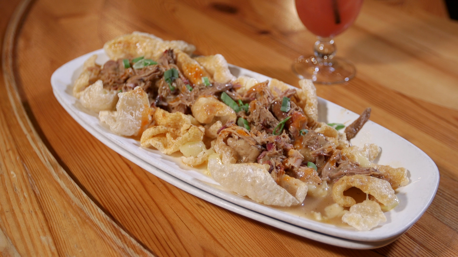Try the pork rind, pulled pork poutine at Pearl's Southern Comfort in