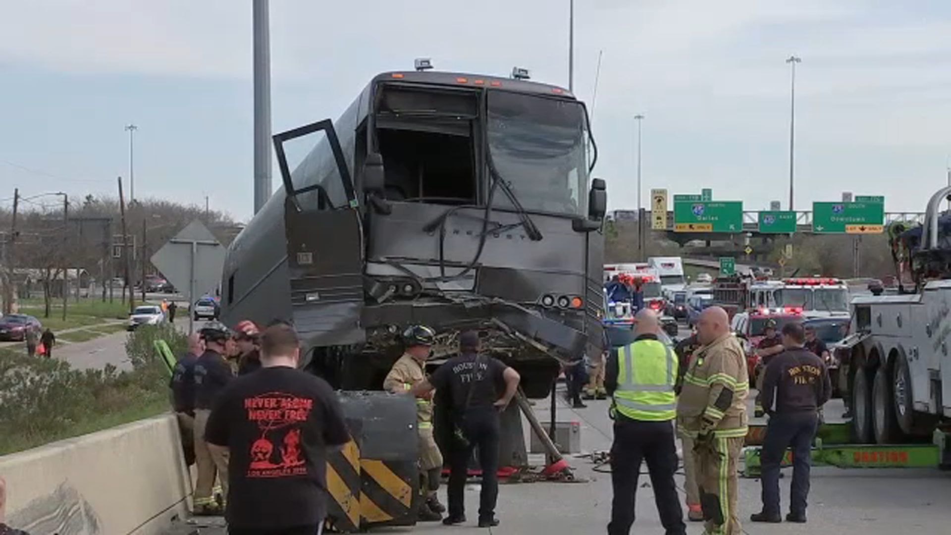 Charter bus slams into barrier on North Loop