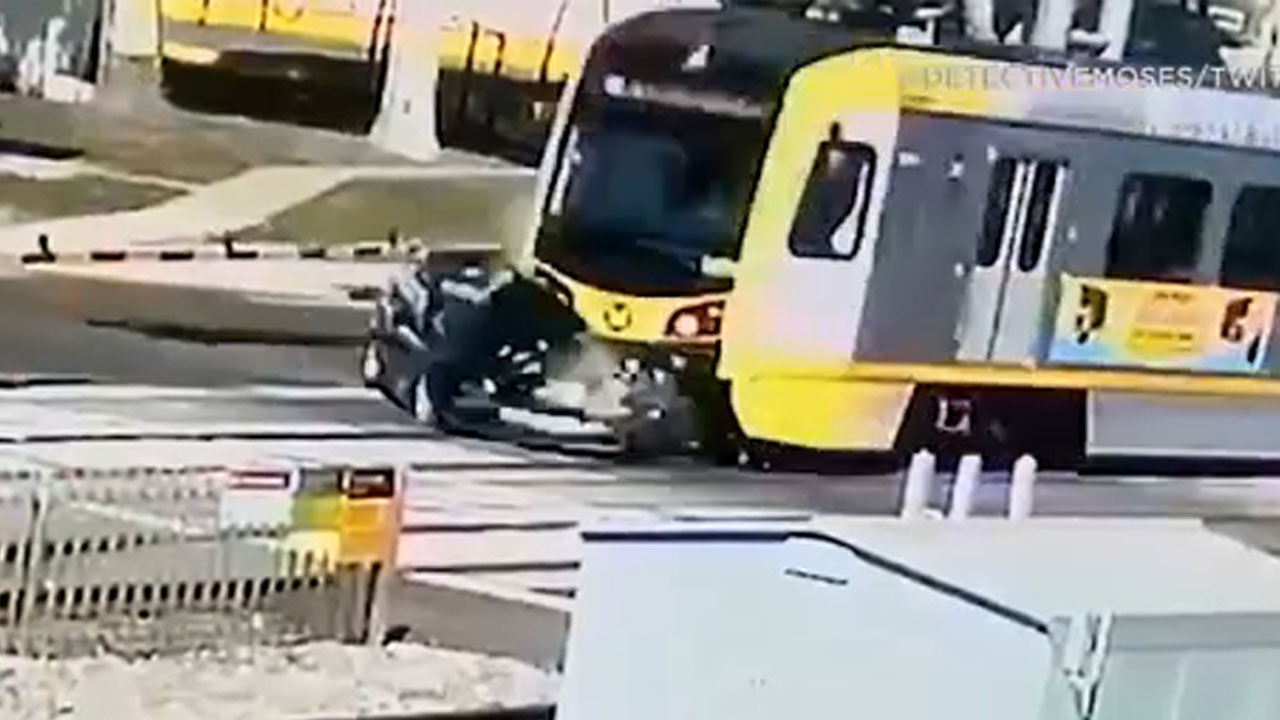 Metro train smashes car on tracks in South LA - video