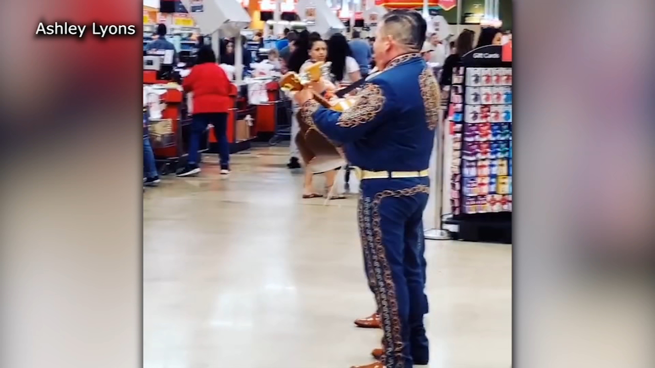 Mariachi band plays music inside a crowded HEB to help ease coronavirus tensions