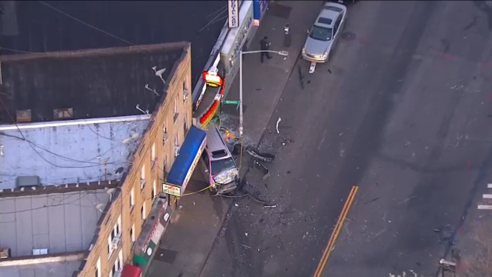 Deadly accident sends one vehicle crashing into store in Jamaica