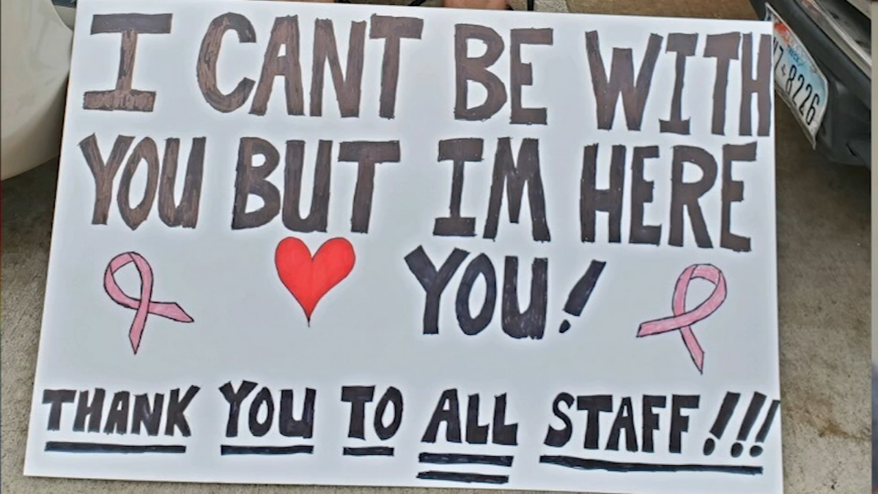 Man supports wife with cancer from street outside