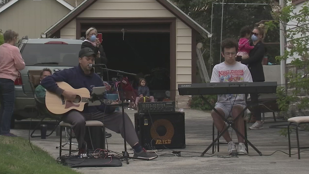 Musician hosts curbside concert for neighbors during COVID-19 shutdown