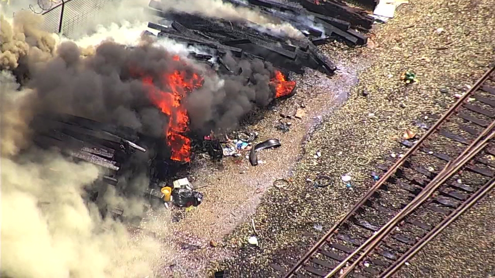 Crews battle large outside fire at Oakland railroad 
