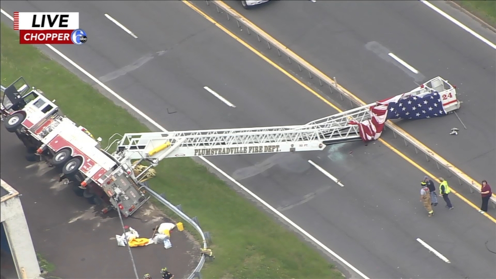 Fire truck adorned with flag tips over in Plumstead Township, Bucks County