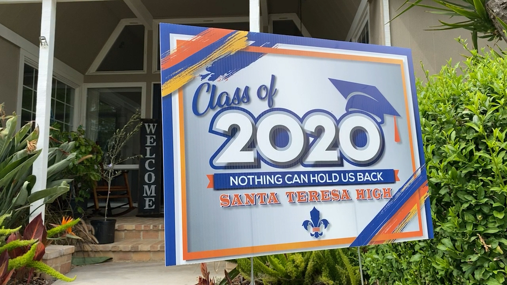 Parents create commemorative signs for high school seniors