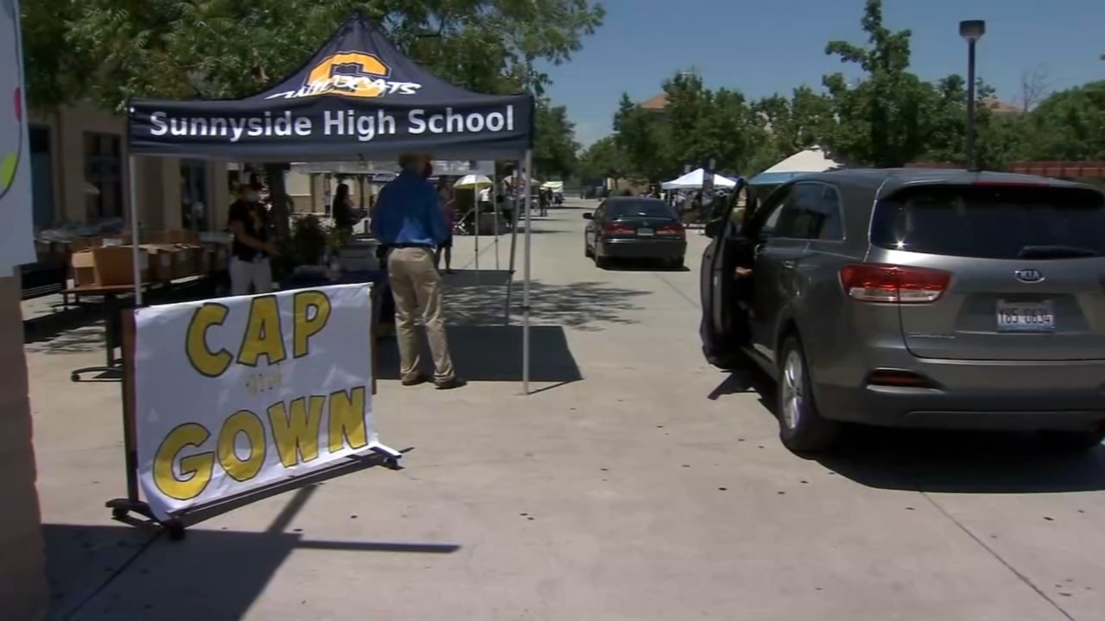 Sunnyside High School seniors visit campus to pick up cap and gown