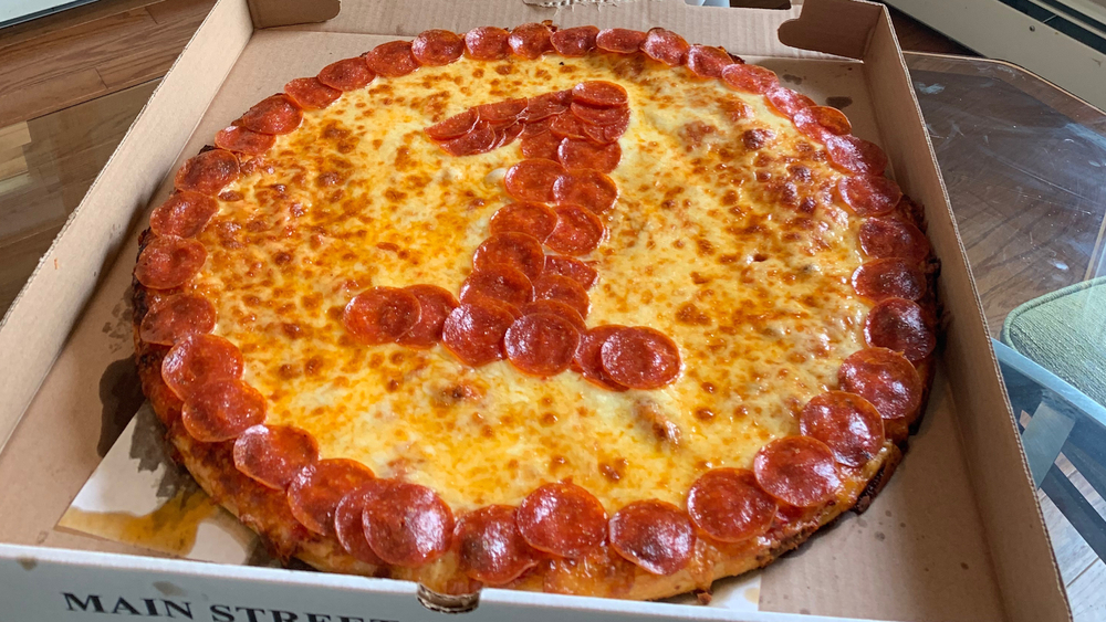 LI pizza joint offers boardgame pizza boxes and luxury car deliveries
