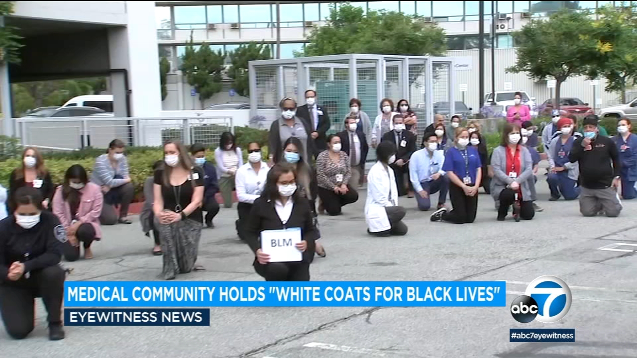 Medical professionals take part in tribute 'White Coats for Black Lives'