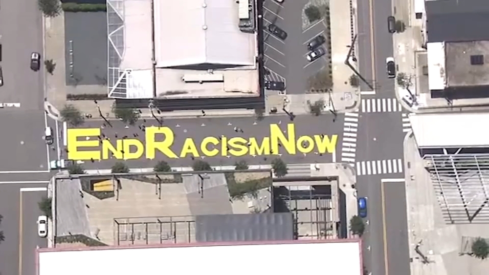 'End Racism Now': A bright yellow message written in the heart of downtown Raleigh