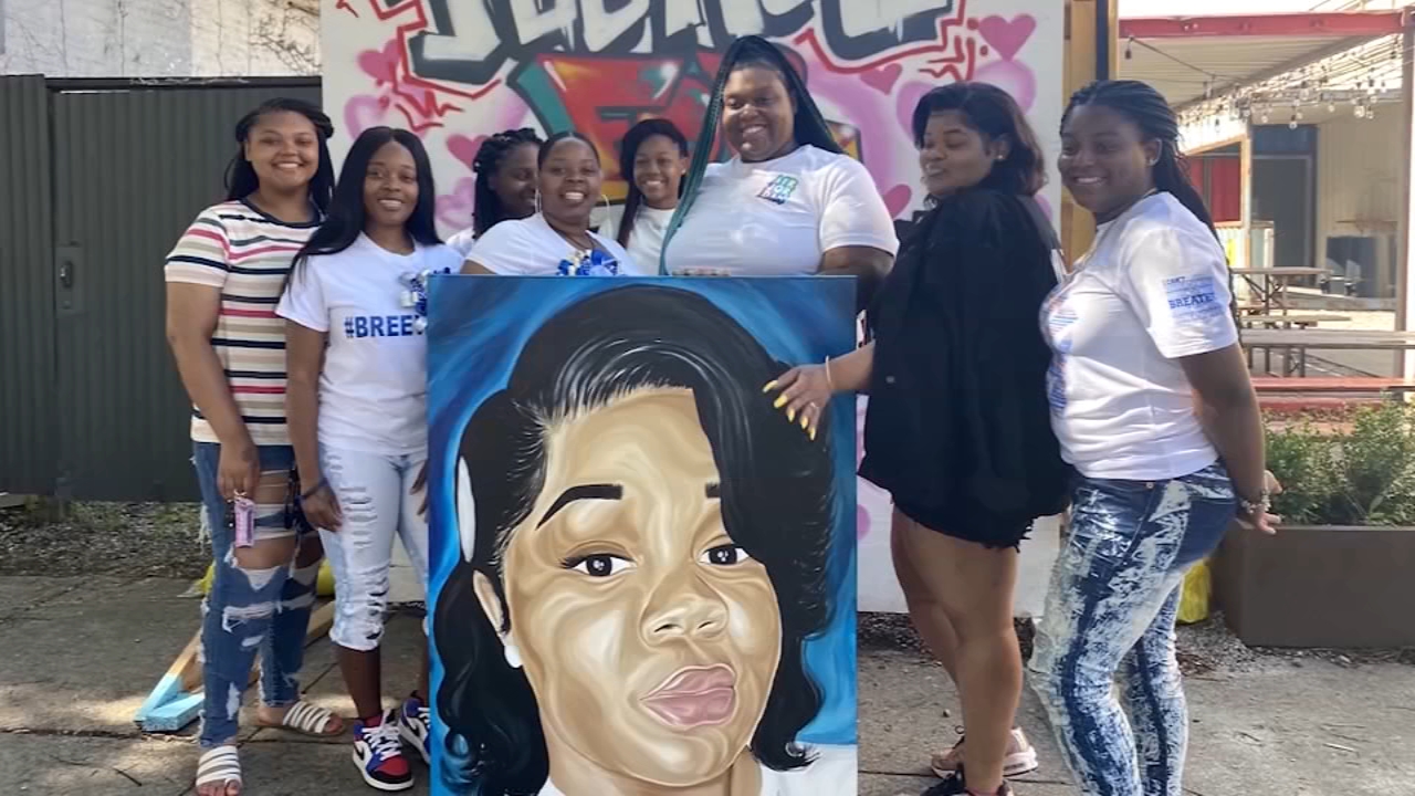 Artists honor Breonna Taylor's memory with mural, poem