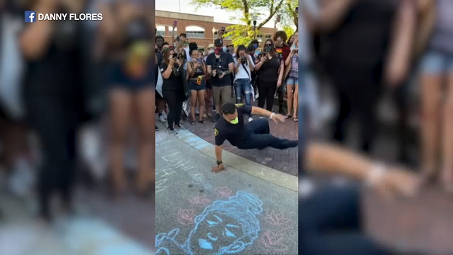 Elgin police officer break dances at Black Lives Matter rally