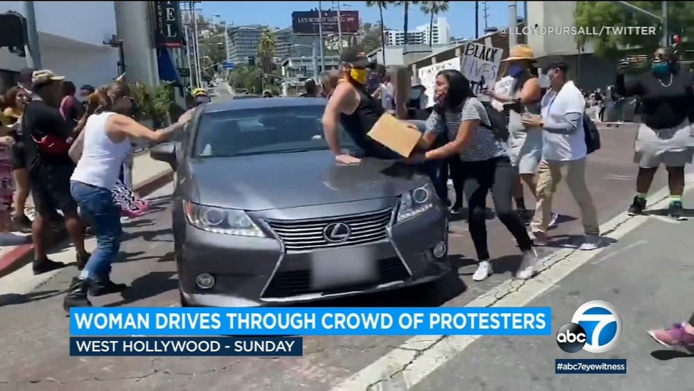 VIDEO: Woman drives through crowd of protesters in West Hollywood