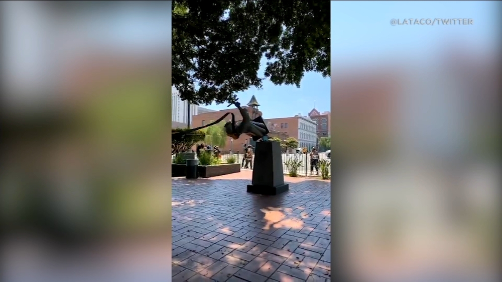 Demonstrators topple statue of Junipero Serra in DTLA