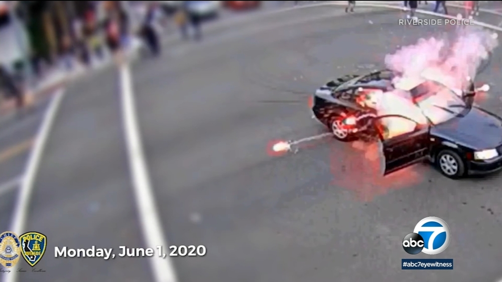 Driver's firework tossed back into car during IE protest - Video