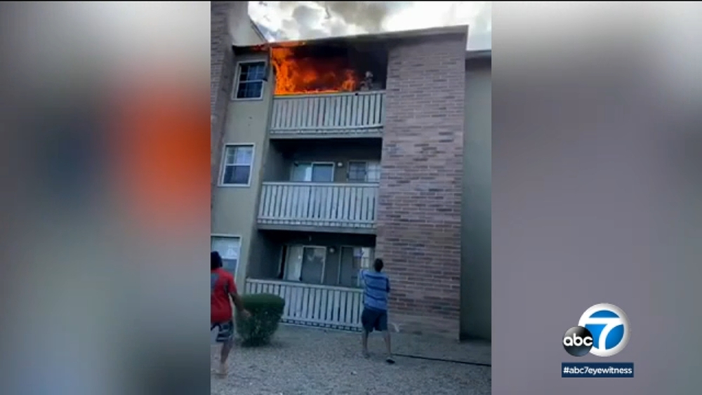 Man catches toddler flung from balcony during apartment fire