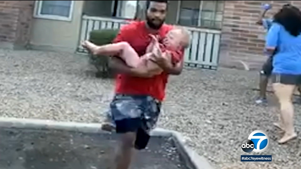 OC wide receiver catches child thrown from burning building