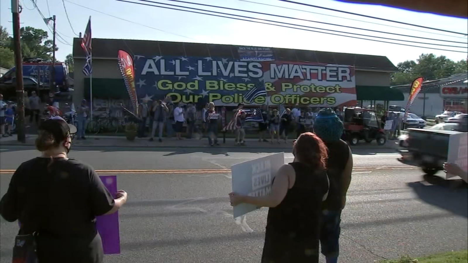 Dueling protests in Oaklyn, New Jersey after business puts up banner