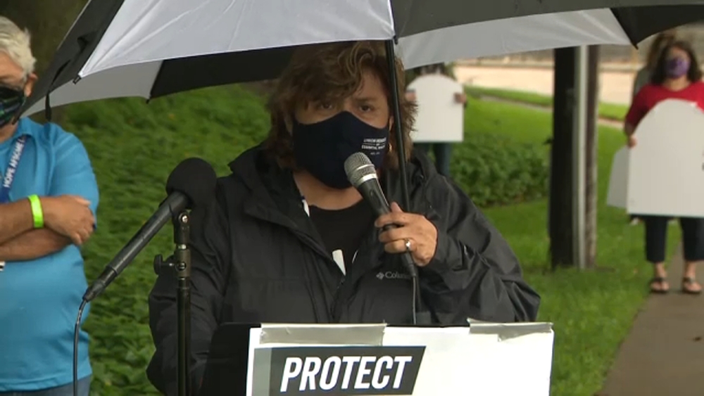Protesters call on Sen. John Cornyn to pass HEROES Act