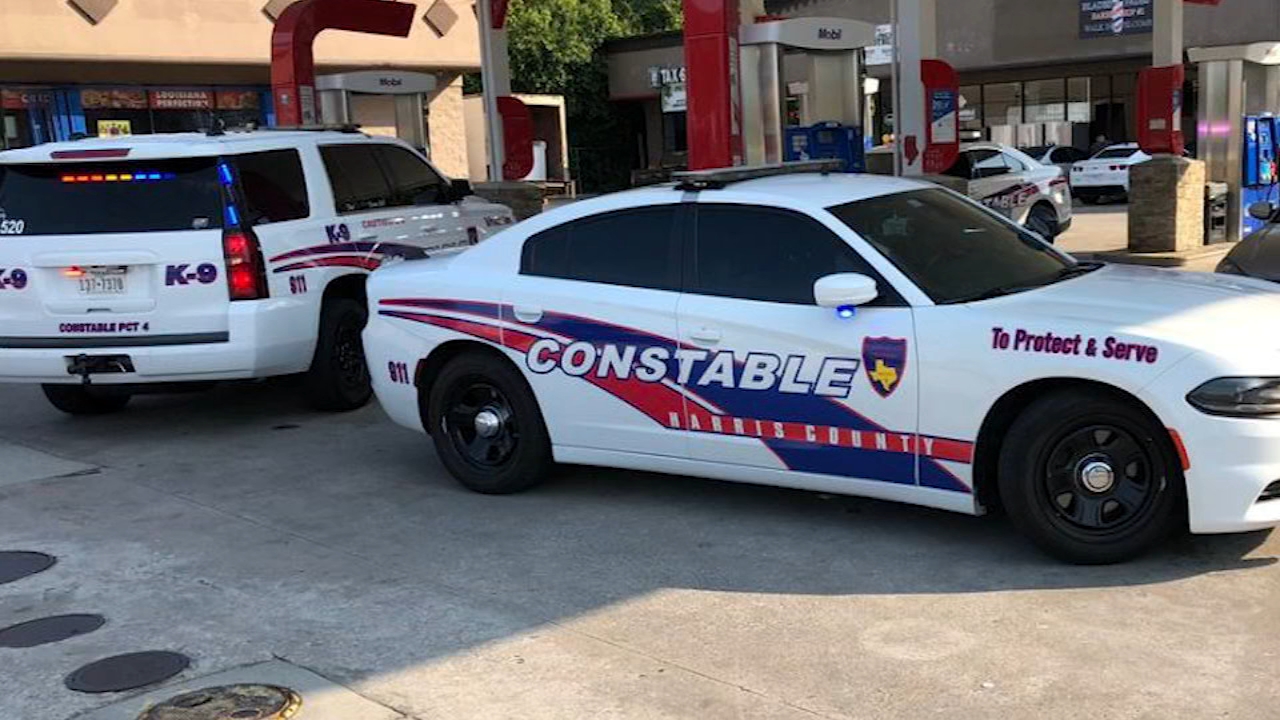 Mother shot while sitting in car with son, officials say