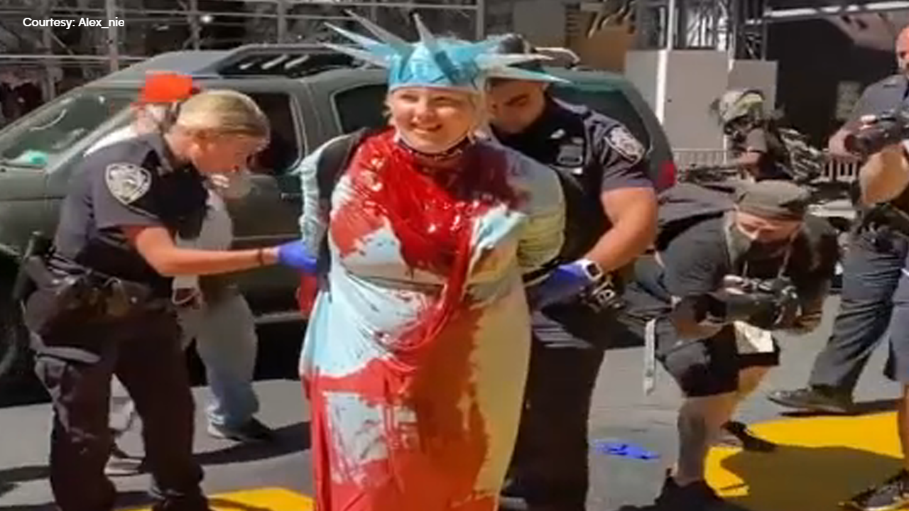 Woman dressed as Statue of Liberty accused of pouring paint on Black Lives Matter mural