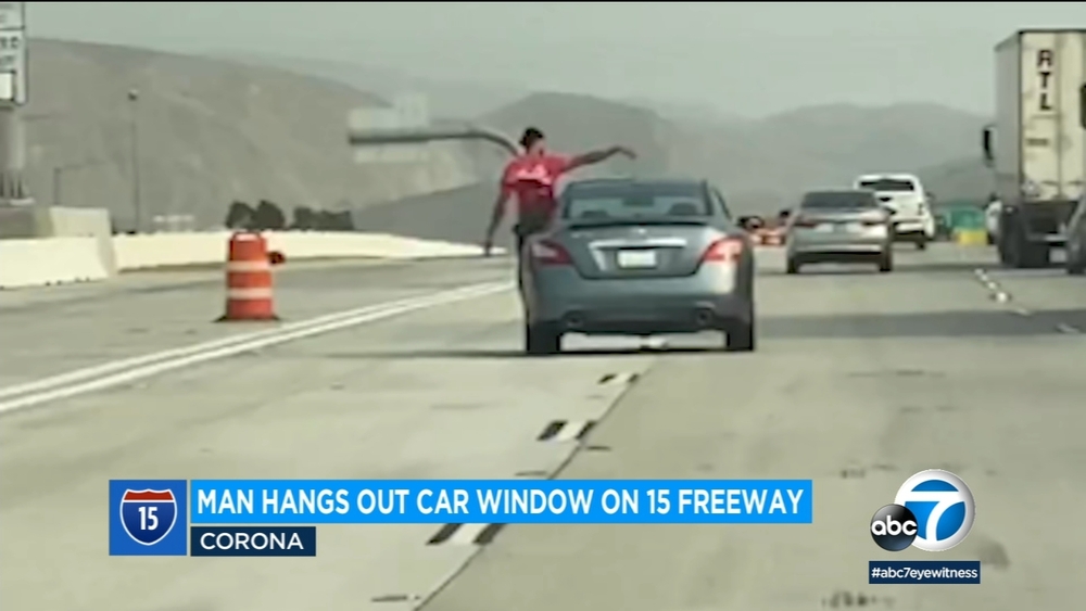 Video shows man hanging out driver's window on 15 Freeway in Corona