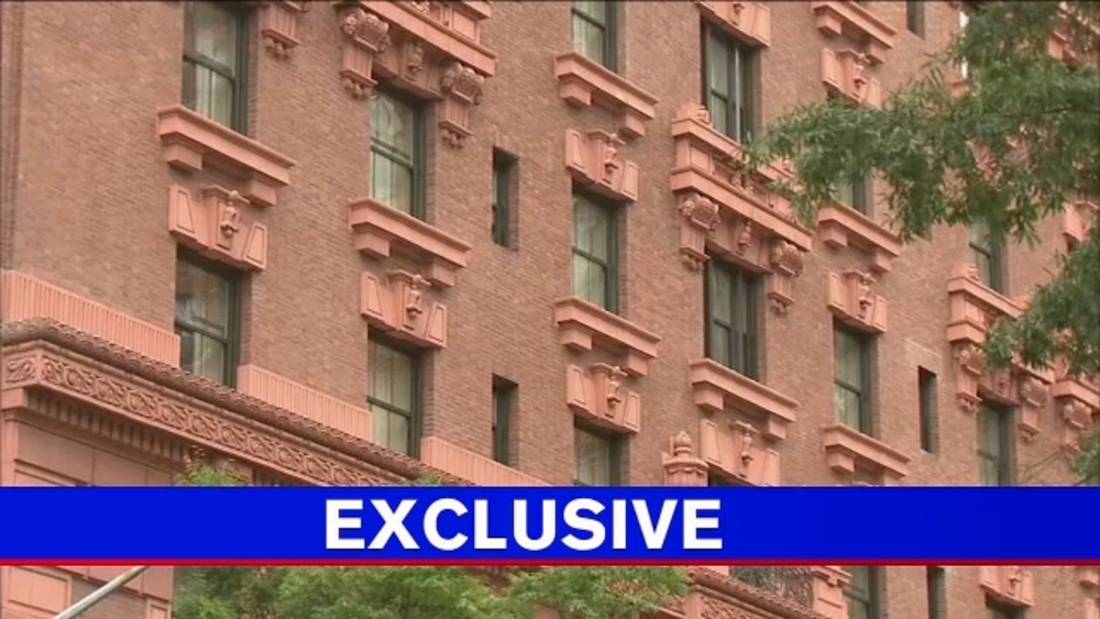 Tenants living in Manhattan hotel alongside homeless men say they "feel trapped"