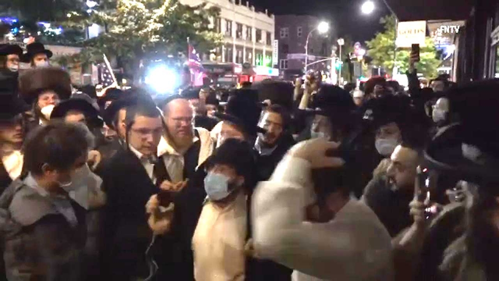 Protesters attack journalist in Brooklyn.