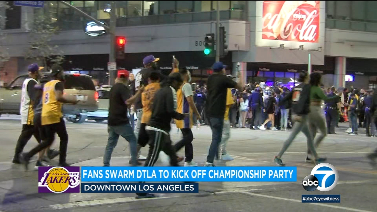 Fans swarm downtown LA near Staples Center, celebrate Lakers' title