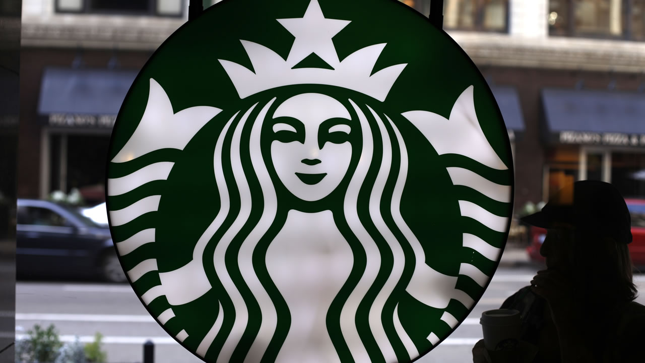 In this Saturday, May 31, 2014, file photo, the Starbucks logo is seen at one of the company's coffee shops in downtown Chicago. 