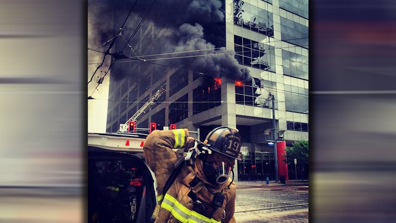 Firefighters battle two-alarm fire in parking garage in downtown