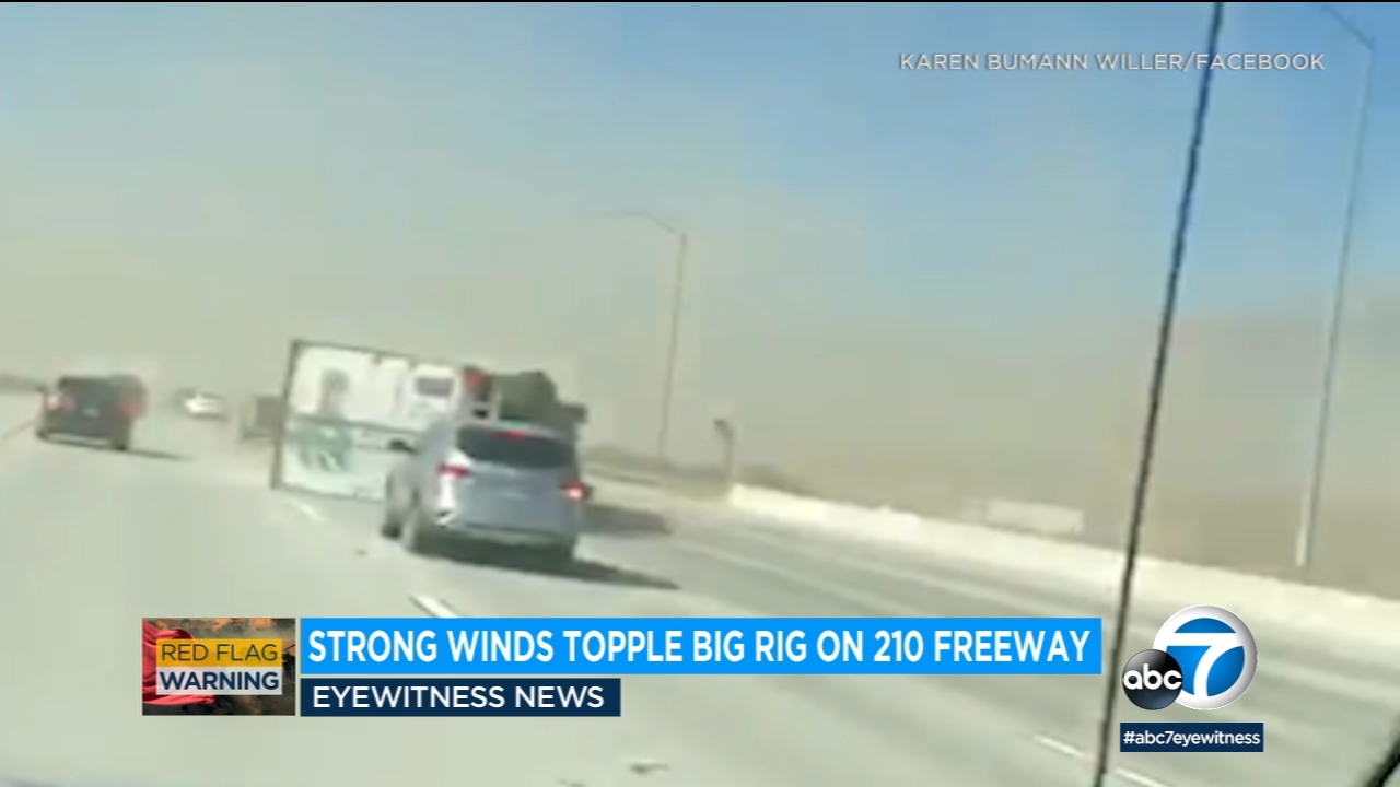 Video: Strong winds topple over big rig on 210 Freeway