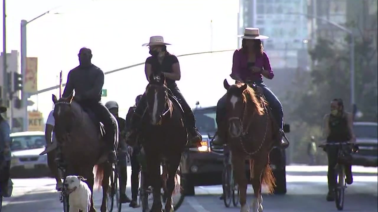 Oakland residents 'ride out the vote' on horseback through drive-by ballot box