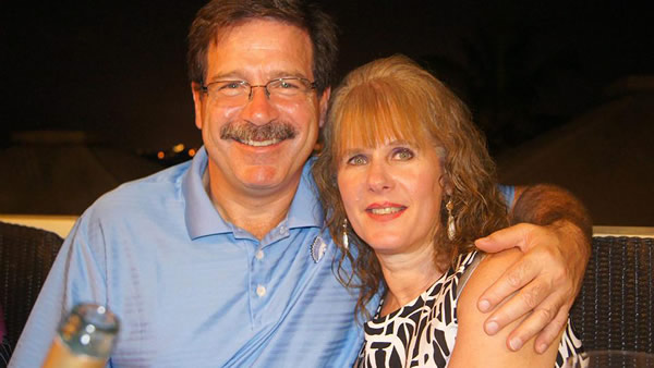 In this undated photo provided by Mark Sherlach, Mark Sherlach and his wife, school psychologist Mary Sherlach, pose for a photo. Mary Sherlach was killed Friday, Dec. 14, 2012, when a gunman opened fire at Sandy Hook Elementary School, in Newtown, Conn., killing 26 children and adults at the school.