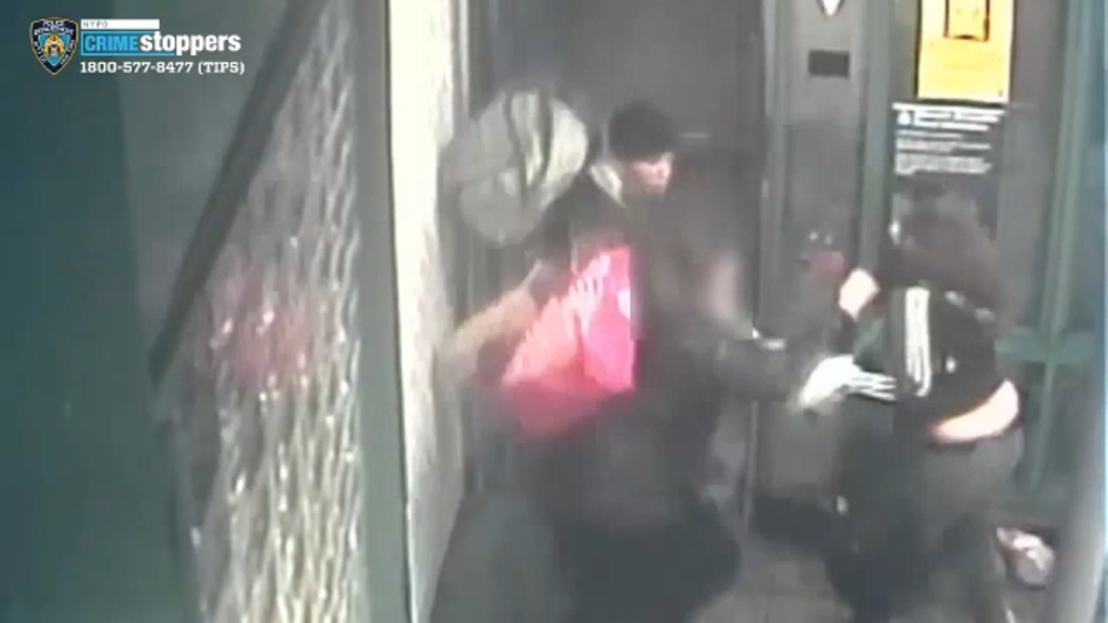 Video: 2 suspects attack woman in elevator over masks