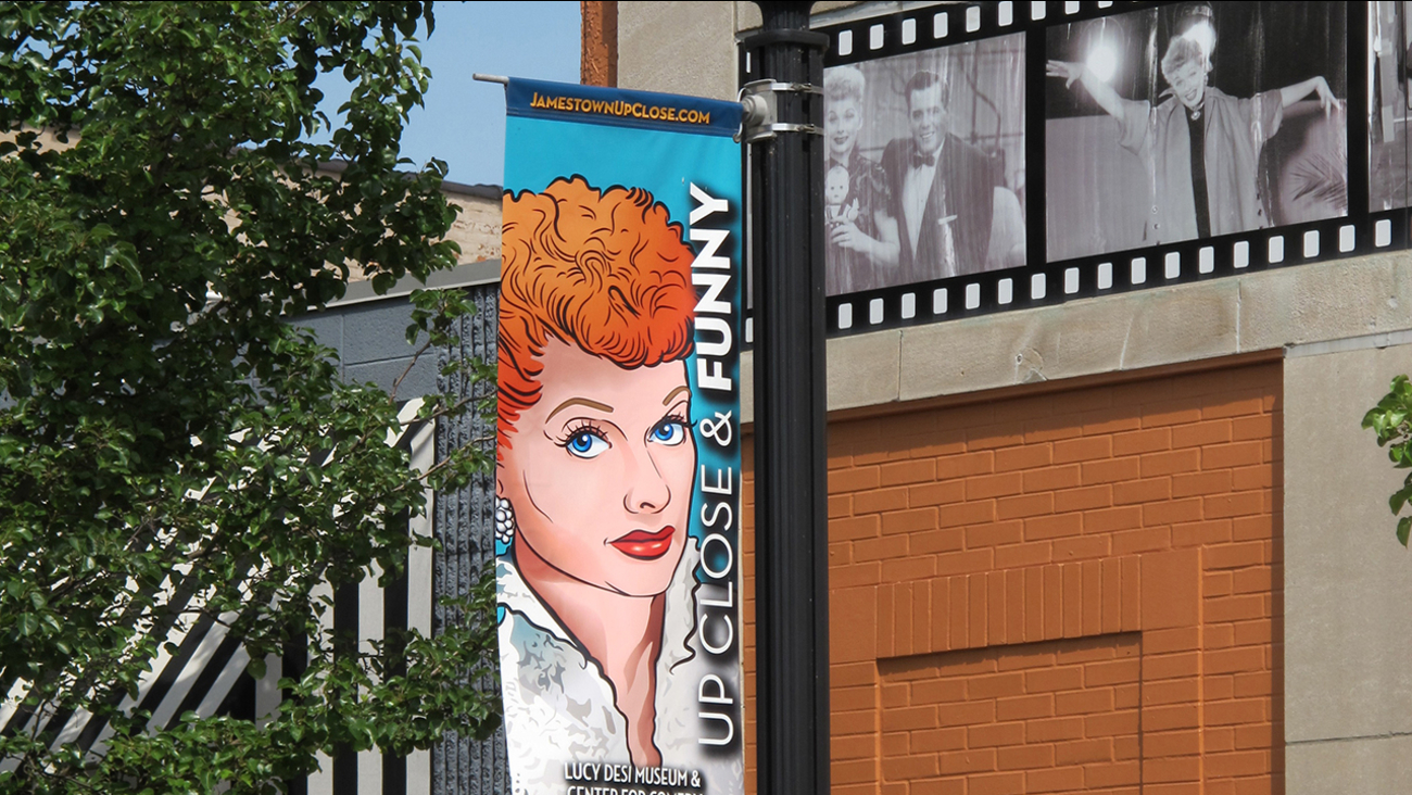 In this June 26, 2015 photo, a banner hangs outside the Lucille Ball-Desi Arnaz Museum in Ball's hometown of Jamestown, N.Y.