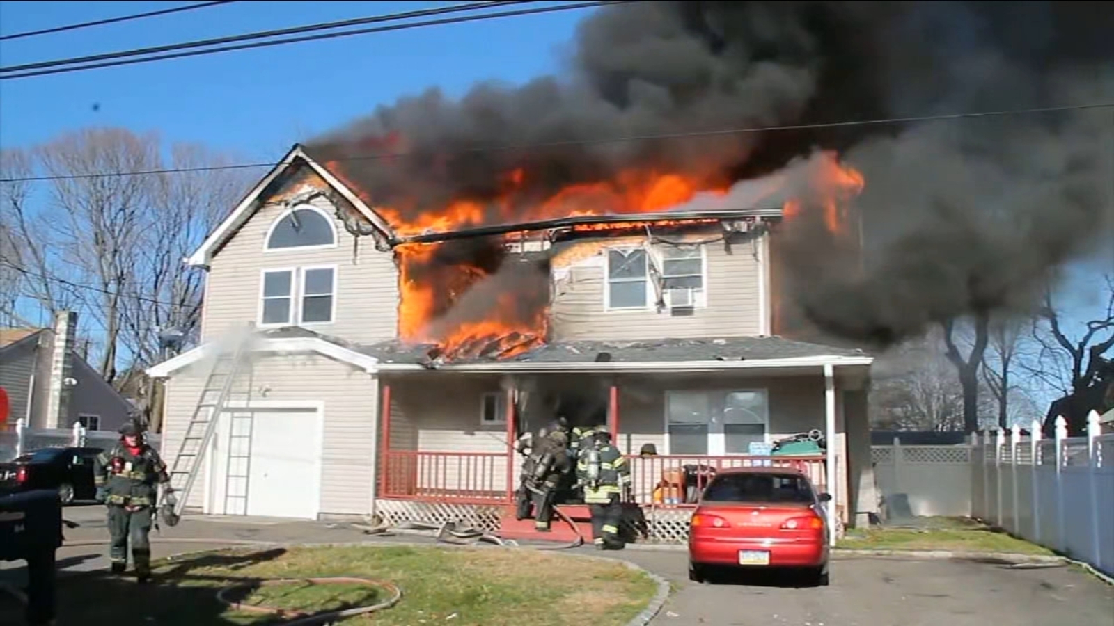 Woman, child escape apparent house explosion that sparked large fire in