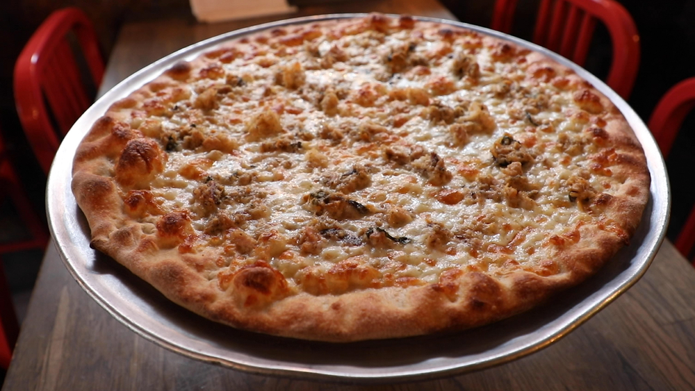 This pizza has 7 different types of seafood on it!
